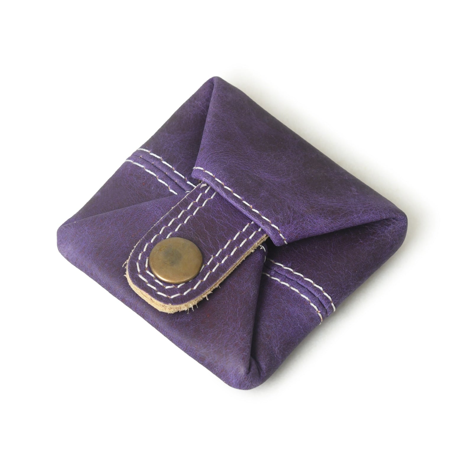 Purple leather coin pouch with white stitching and a brass button closure, shown on a white background.