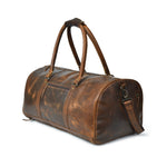 Stylish brown leather duffle bag with a detachable shoulder strap and separate shoe compartment.