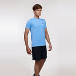 Man wearing a blue, short sleeve, dry fit, crew neck t-shirt.