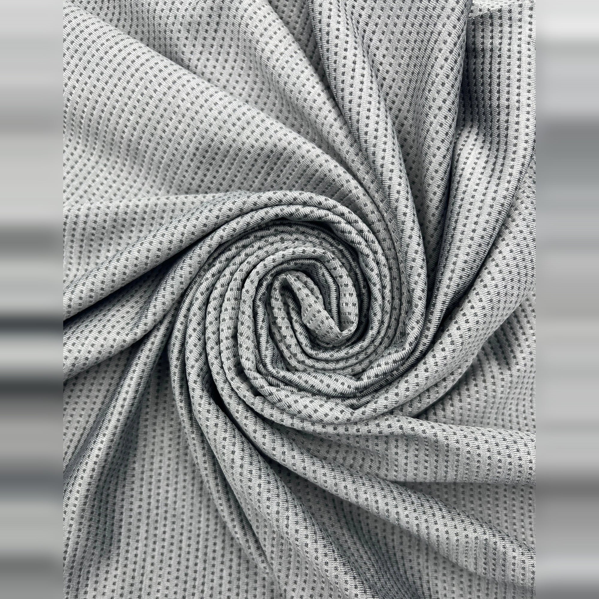 Close-up of breathable, gray fabric used for Men's Casual Slim Fit Short Sleeve T-Shirt.