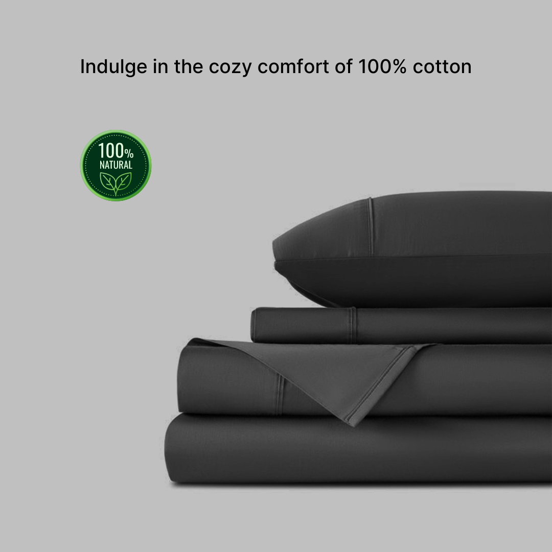 Grey Egyptian cotton bedsheet set (king-size) with two pillowcases, neatly folded. Soft, breathable, and made from 100% natural cotton with a 300 thread count.