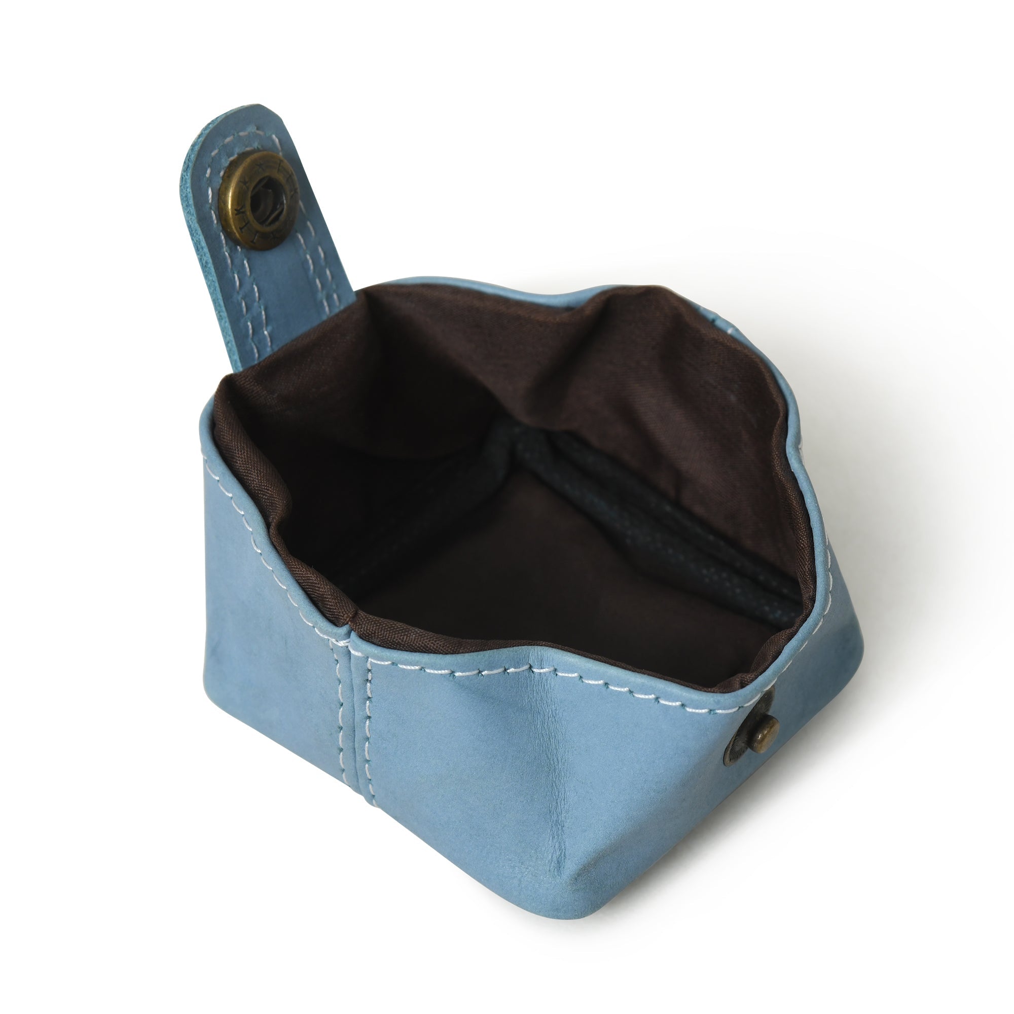 Open blue leather coin purse with brown lining, showcasing its slim and stylish design.