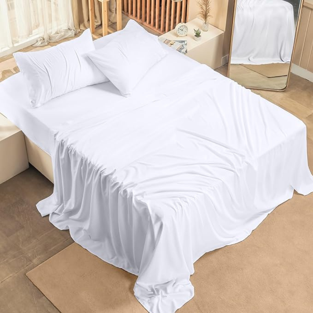 Crisp white 300 thread count Egyptian cotton bed sheets on a queen size bed, shown draped smoothly for a luxurious look.