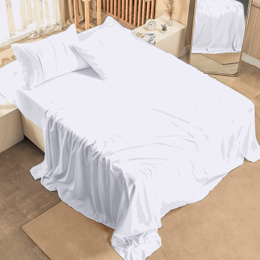 Crisp white 300 thread count Egyptian cotton bed sheets on a queen size bed, shown draped smoothly for a luxurious look.