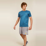 Man wearing a blue dry-fit crew neck t-shirt ideal for workouts and athletic activities.