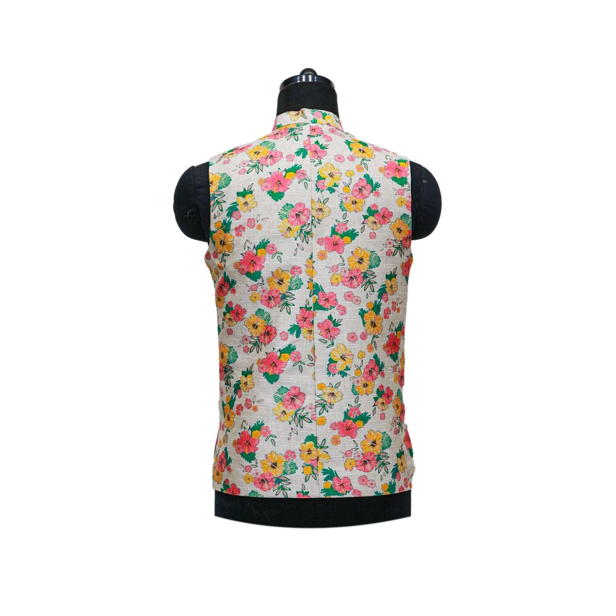 Handmade floral Nehru jacket, shown from the back on a mannequin, features a vibrant floral pattern on a light fabric.