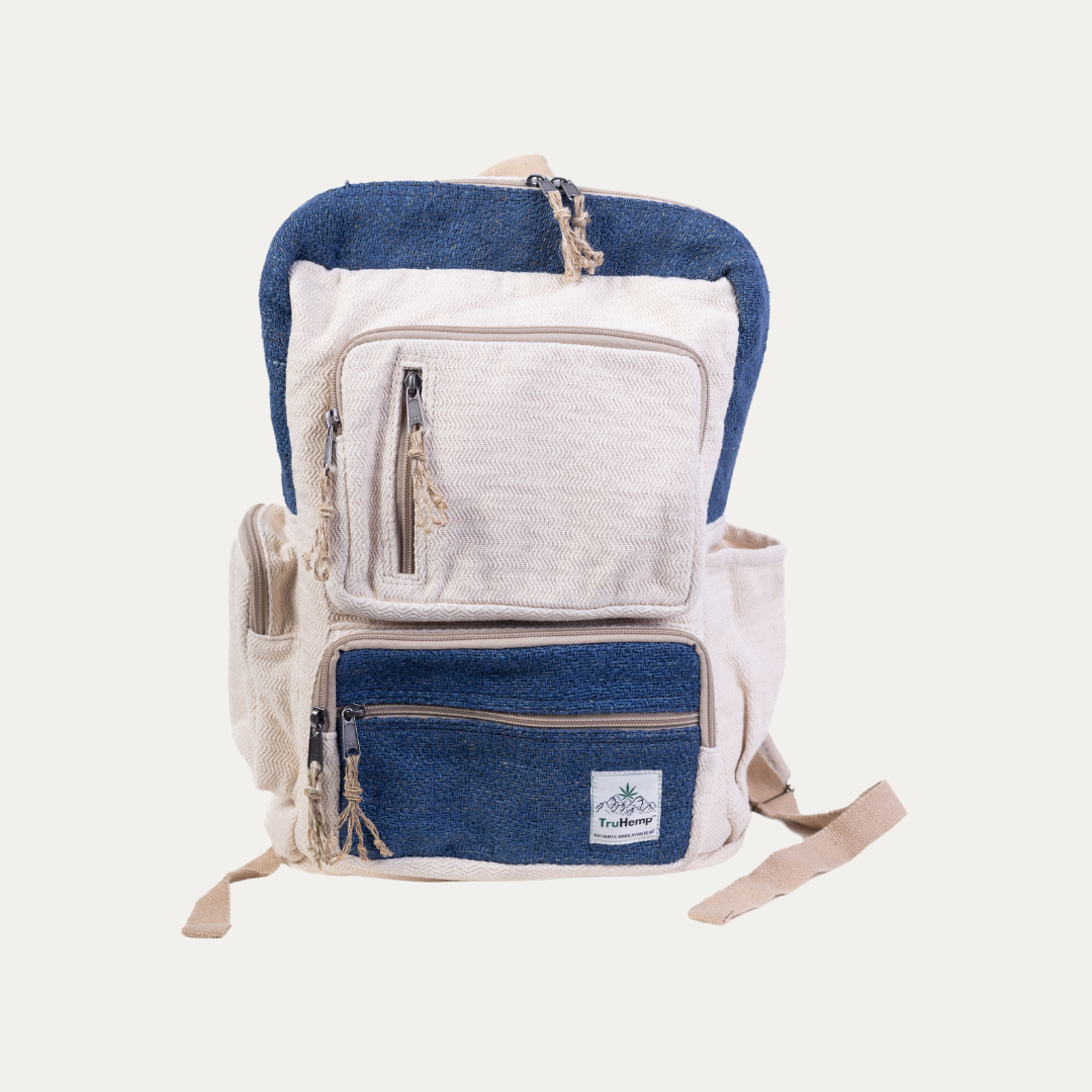 Handmade, multi-pocket hemp backpack in natural and blue. Features multiple zippered compartments for organization and adjustable straps for comfortable carrying.