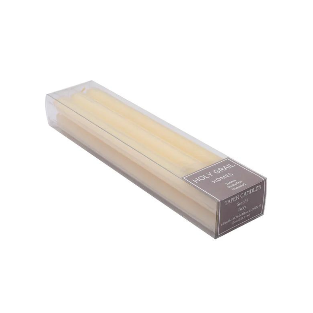 Set of six unscented ivory taper candles in clear packaging. Smoke-free and perfect for elegant ambiance.