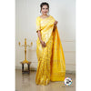 A woman stands elegantly draped in a Sunflower Yellow Banarasi Tissue Silk Saree, its intricate gold brocade patterns shimmering in the light.