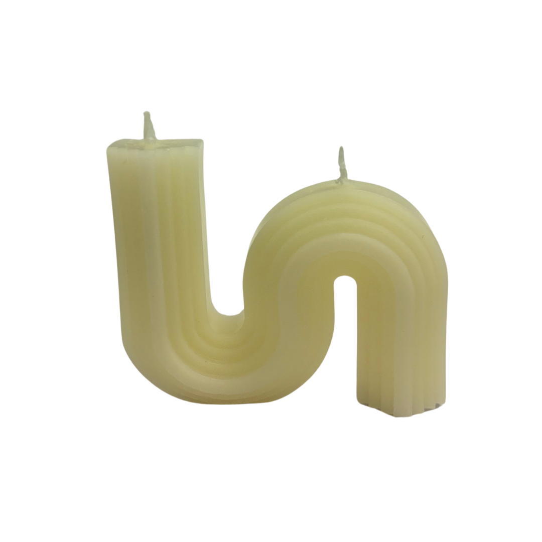 Set of 4 white wavelet-shaped soy wax candles with a pleasing abstract design. Unscented.