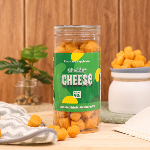 Crack A Nut's Cheddar Cheese Roasted Multi-Grain Puffs, Savory & Healthy Snack, Packed with Protein & Low in Sugar, Lightly Roasted Multi-Grain Goodness, Perfect for Cravings & Guilt-Free Indulgence, 100g.