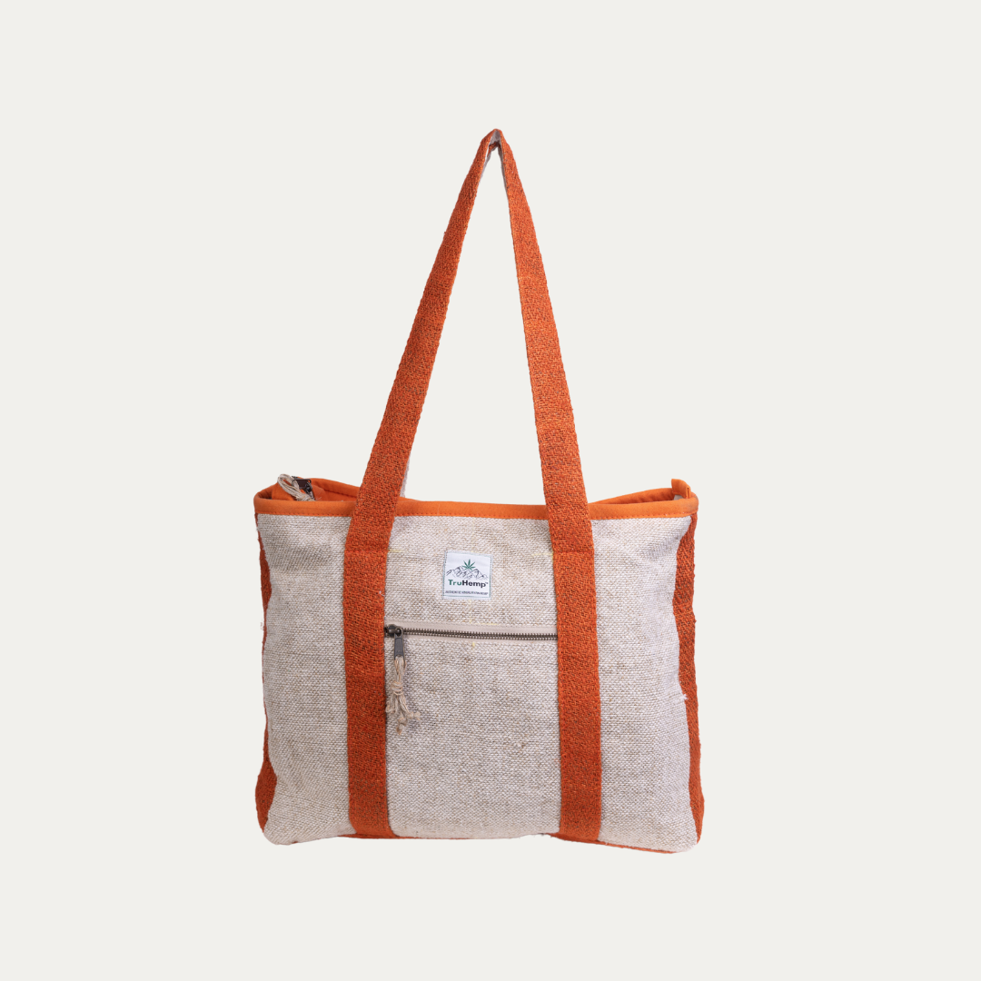 Eco-friendly and stylish, this off-white hemp tote bag with orange straps is perfect for everyday use.