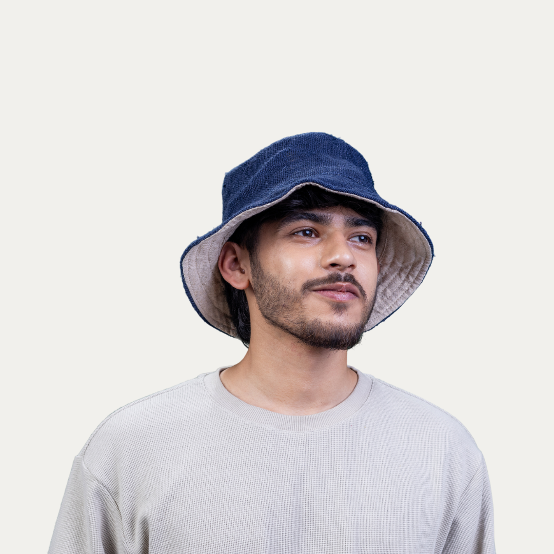 Model is wearing a stylish hemp bucket hat offering UV protection and easy airflow for comfortable wear.