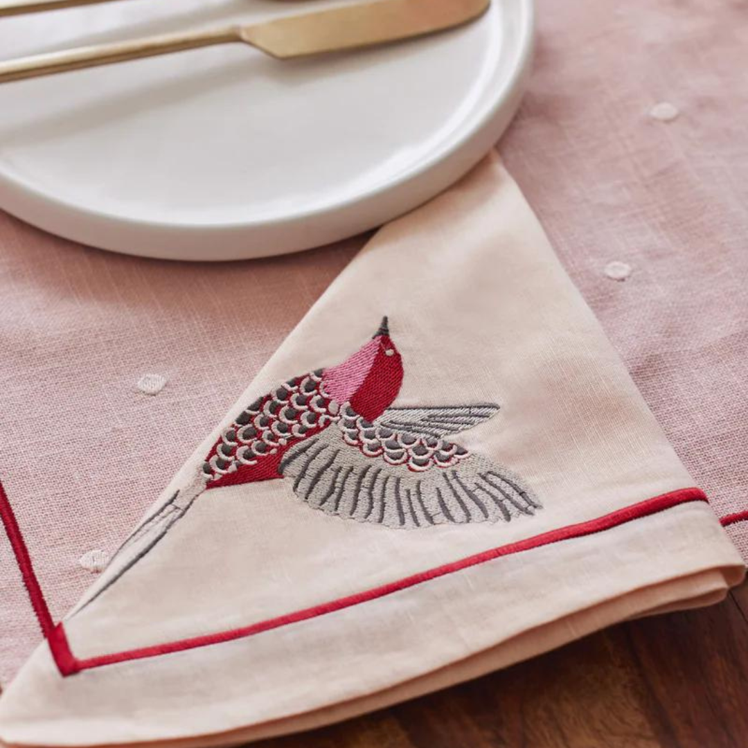 Scarlet French linen table linen set with embroidered bird detail. Set includes 6 placemats, 6 napkins, and 1 table runner.