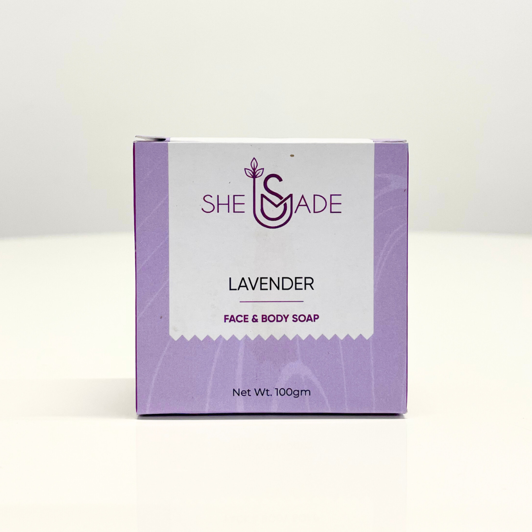 Handcrafted lavender soap bar in purple packaging by SheSmade. This face & body soap is great for healing body acne.