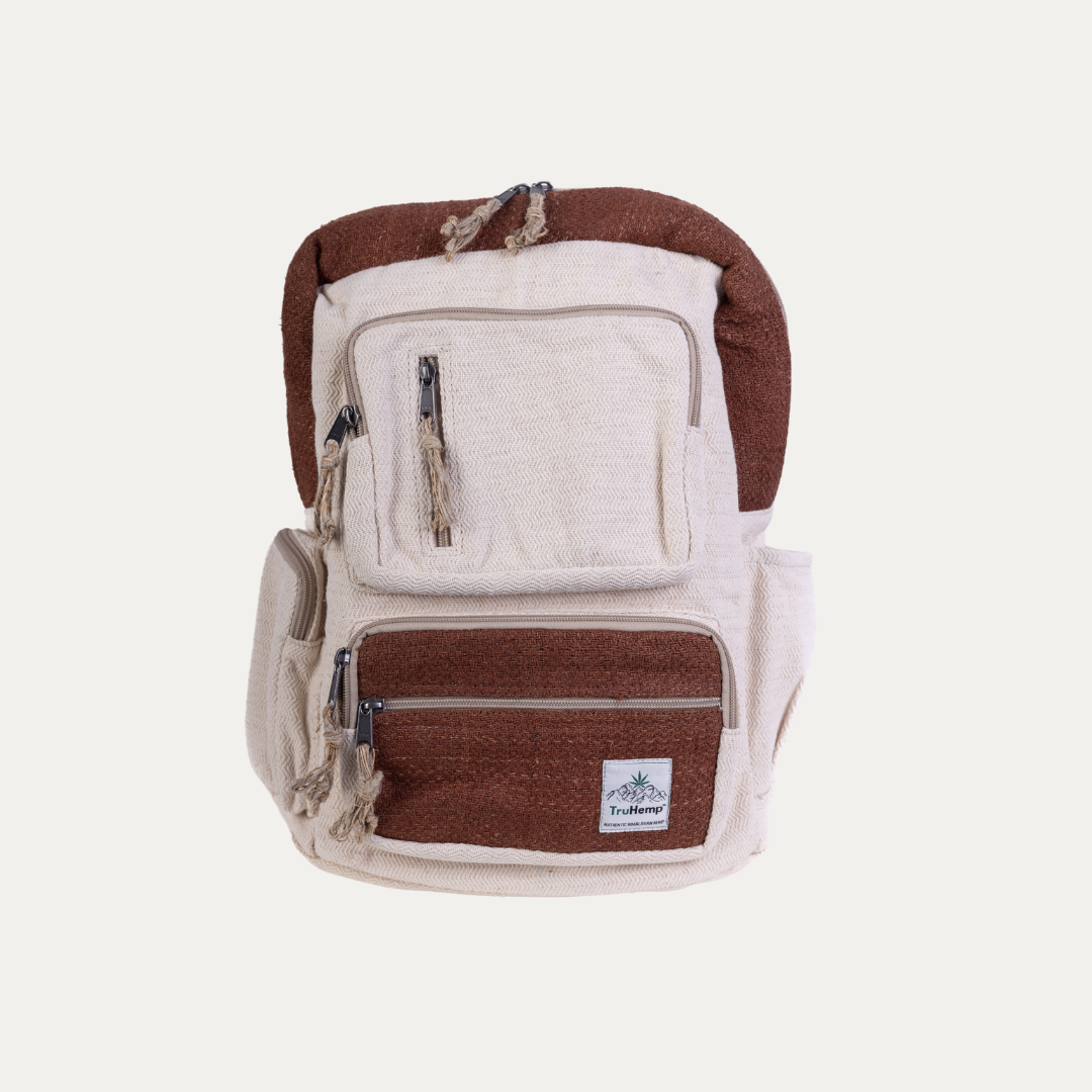 Handmade hemp backpack in natural with brown accents, featuring multiple pockets with zipper closures for secure storage.