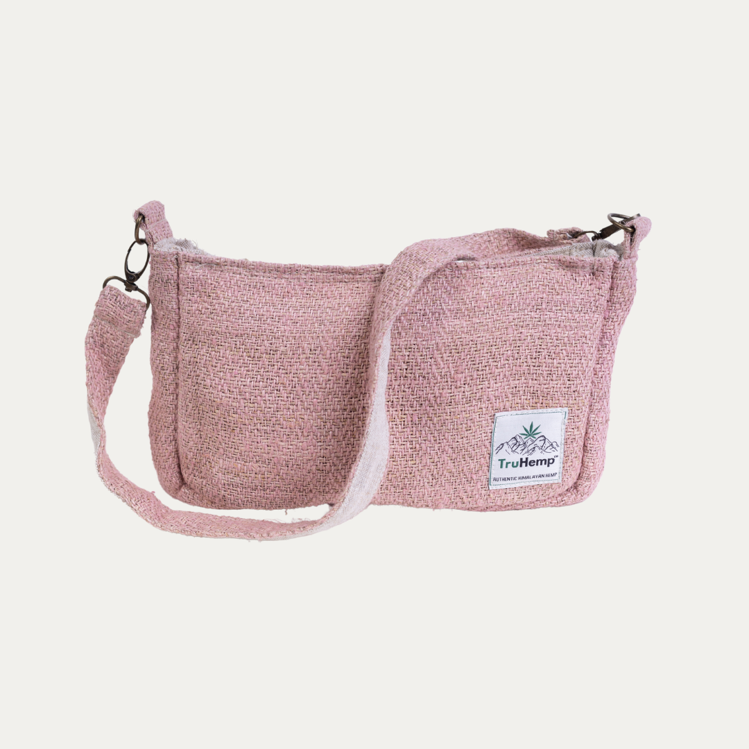 Pink sling shoulder bag made from hemp with an adjustable strap, shown on a white background.