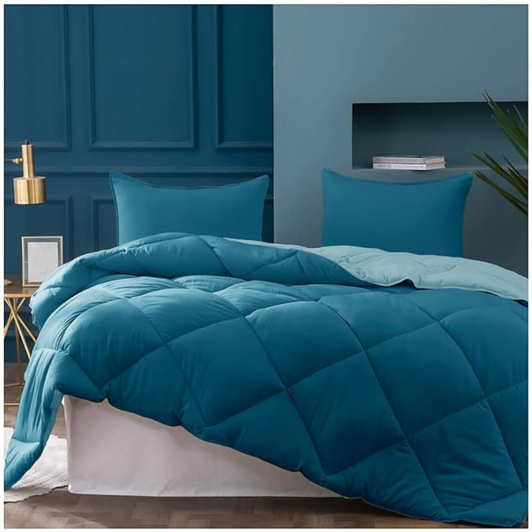 Teal Bellolin Microfibre Reversible Comforter on a made bed. This double bed comforter is soft, comfortable, lightweight, and breathable.