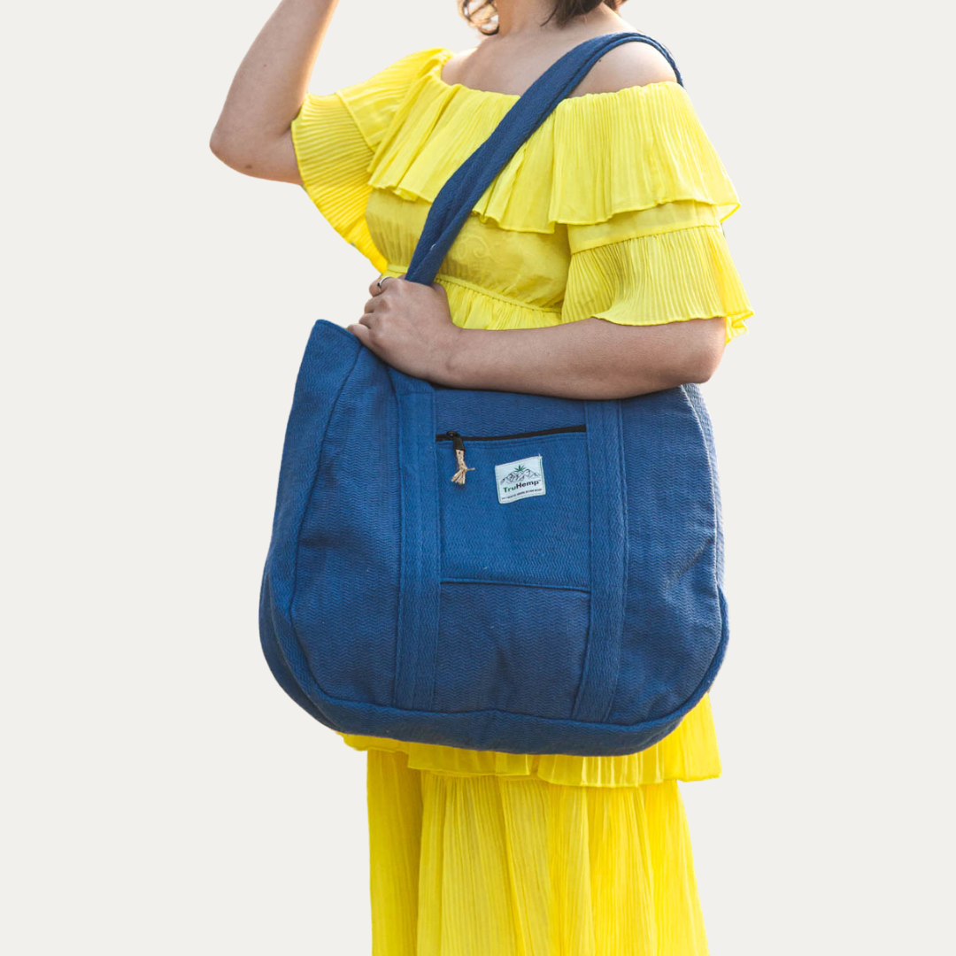 Woman carrying a spacious blue Himalayan Hemp Tote Shoulder Bag, perfect for everyday use.