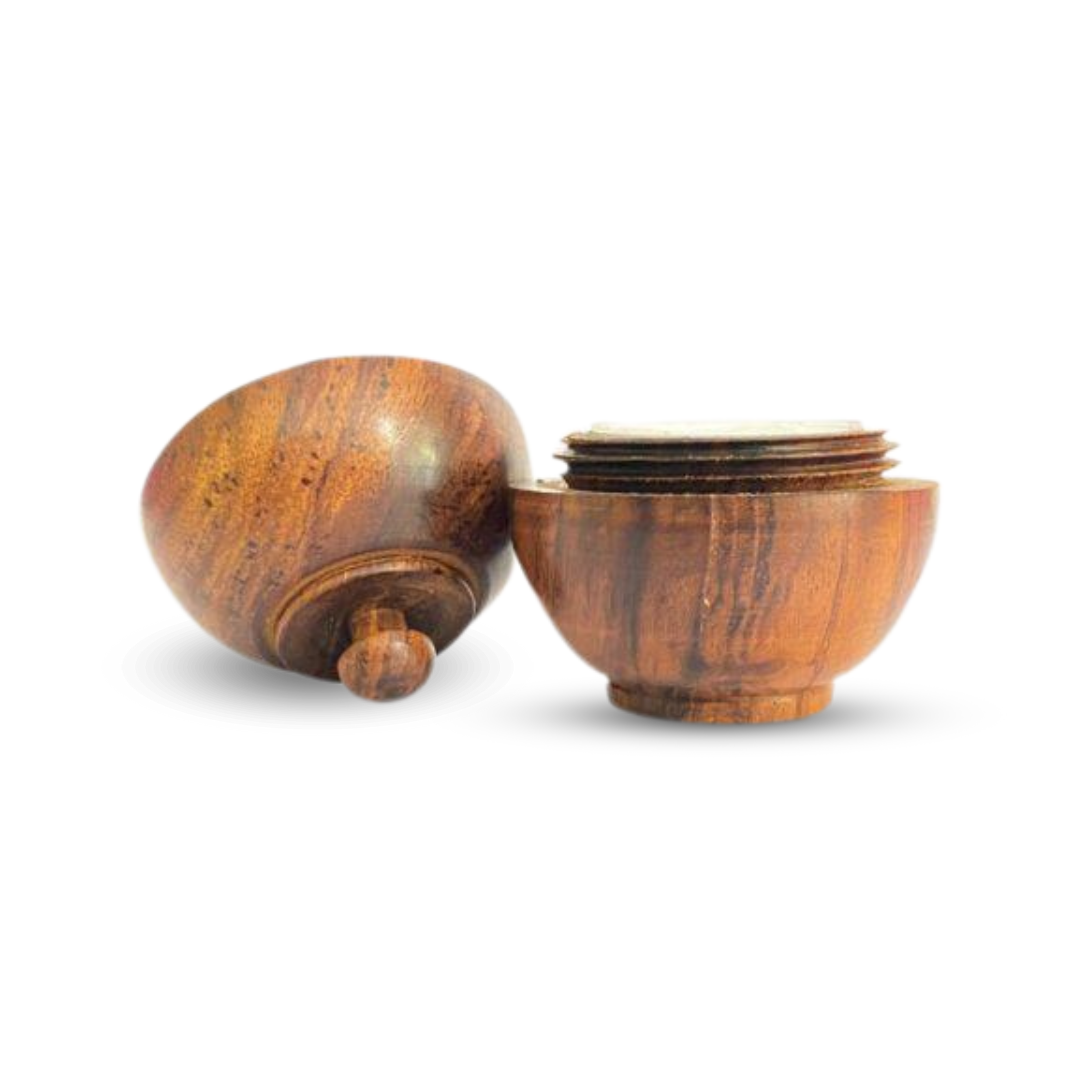 Open wooden container for natural solid body wax perfumes, showcasing Indian beauty traditions.