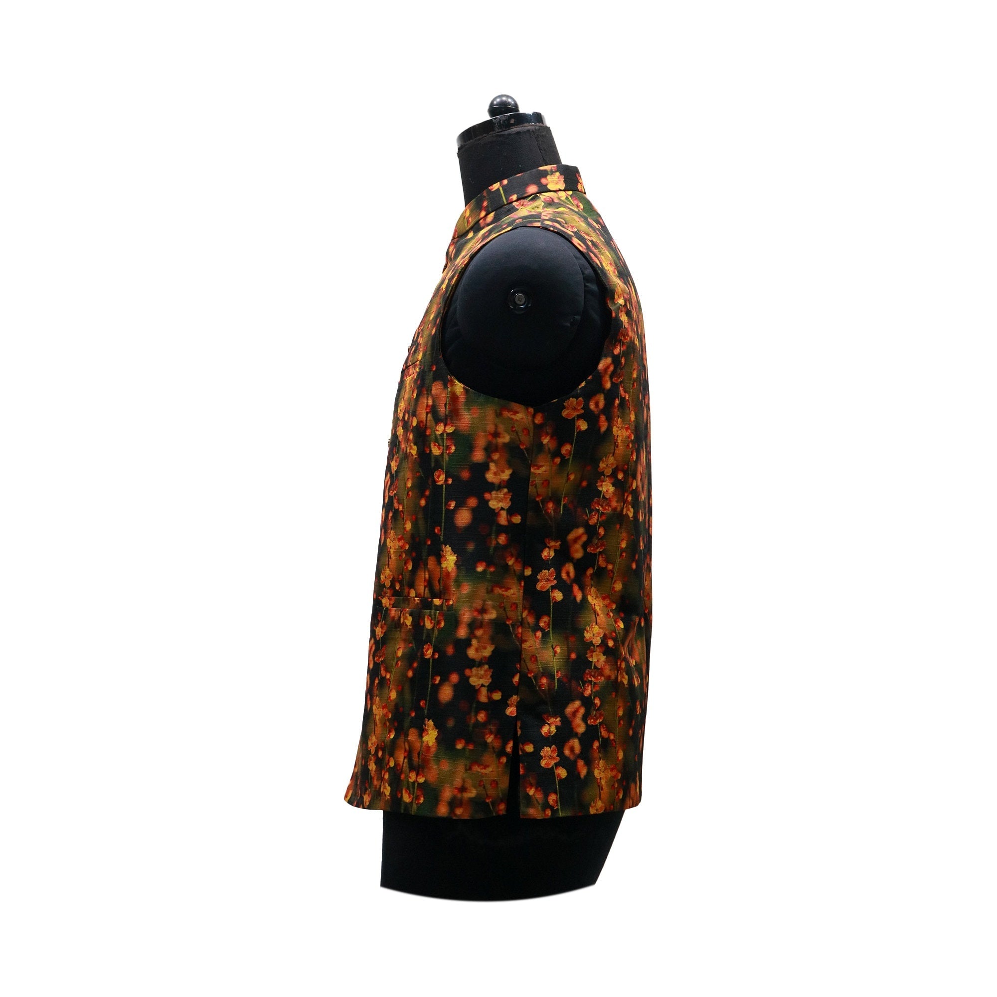 Handmade vintage floral Nehru jacket in black with orange and yellow floral print, side view on mannequin.