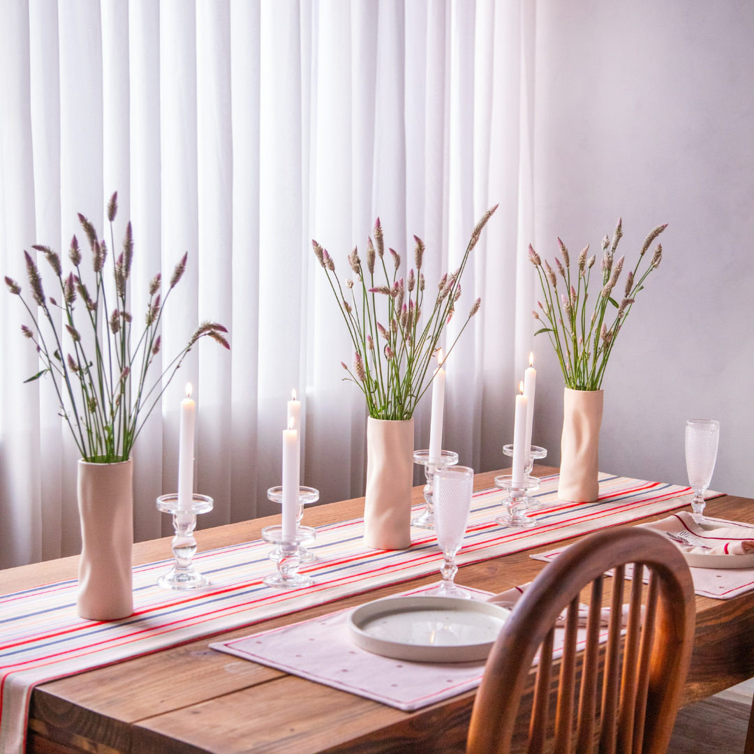 A French Stripe Cotton Table Runner (14X82 inches) adds a touch of classic style to a dining table decorated for a casual gathering.