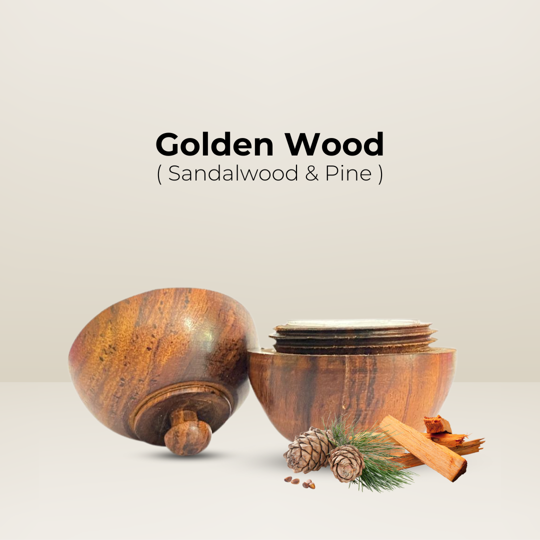 Open wooden jar of Golden Wood solid perfume with sandalwood, pine, and cedarwood ingredients beside it.