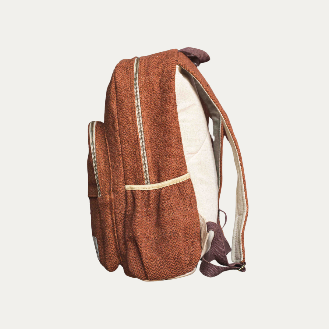 Side view of a stylish, eco-friendly hemp backpack in a rich brown color.