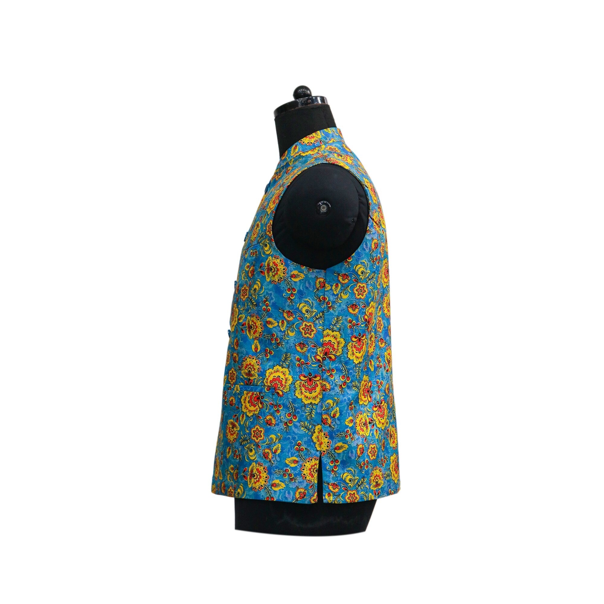 Blue floral Nehru jacket on mannequin, side view. Vibrant yellow and orange floral pattern on a blue background. Perfect for parties or ethnic events.