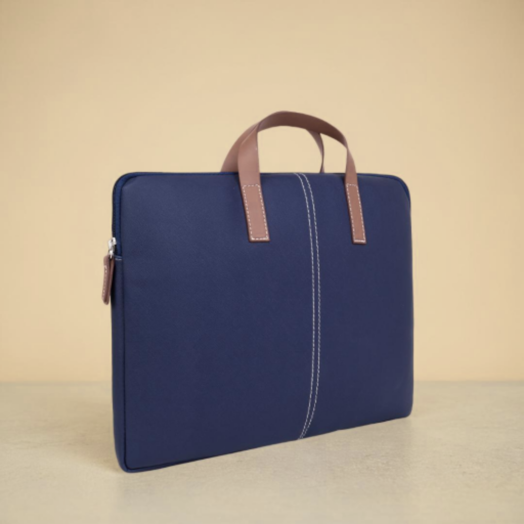 Stylish blue laptop bag with brown faux leather handles, suitable for laptops up to 15.6 inches.