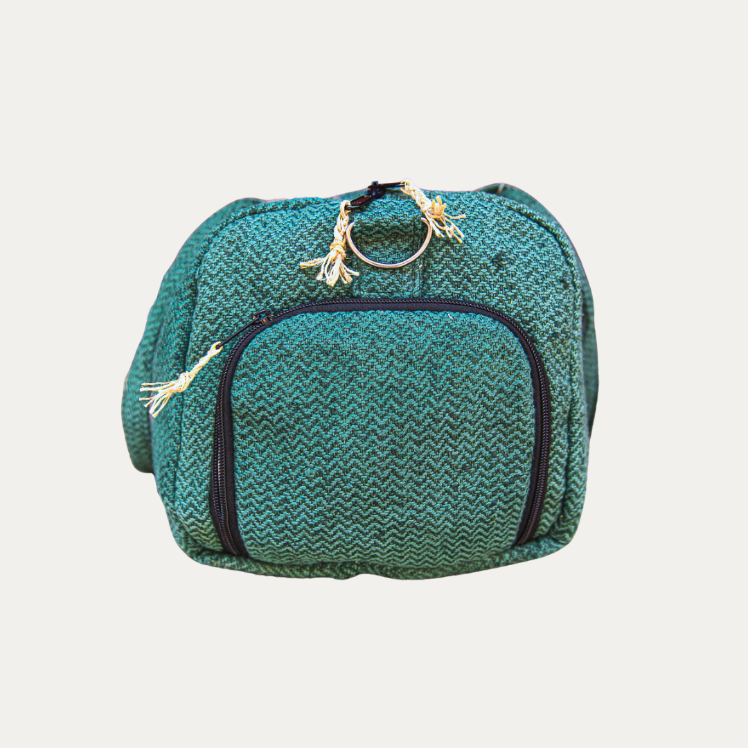 Eco-friendly hemp duffle bag in green, featuring a separate shoe pocket and a durable zipper closure.