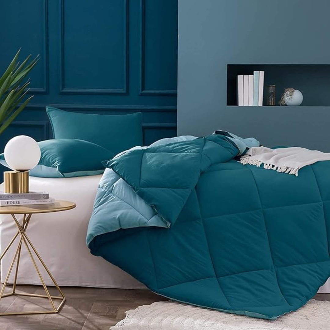 Soft, teal Bellolin microfiber comforter on a bed. The comforter is reversible and perfect for a double bed with its lightweight, breathable design.