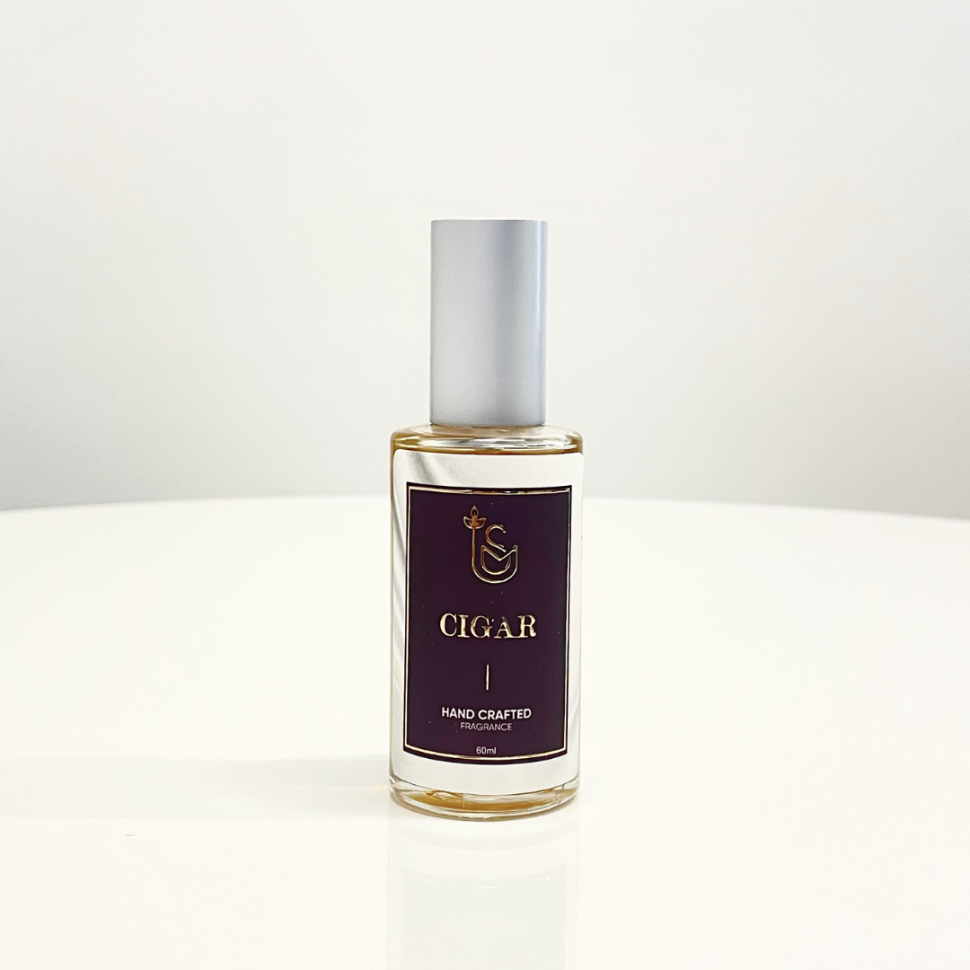 A bottle of Smokes N' Cigar Perfume, a unisex fragrance, presented on a white background.