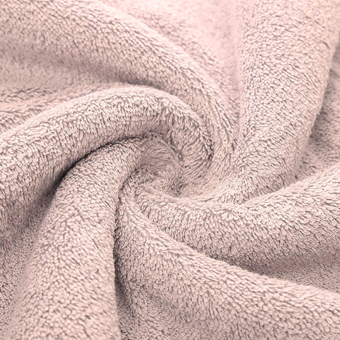 Soft, plush texture of a pink Ultra-Soft Bamboo Cotton Bath Towel (70x140 cm). Made from bamboo cotton for a luxurious feel.