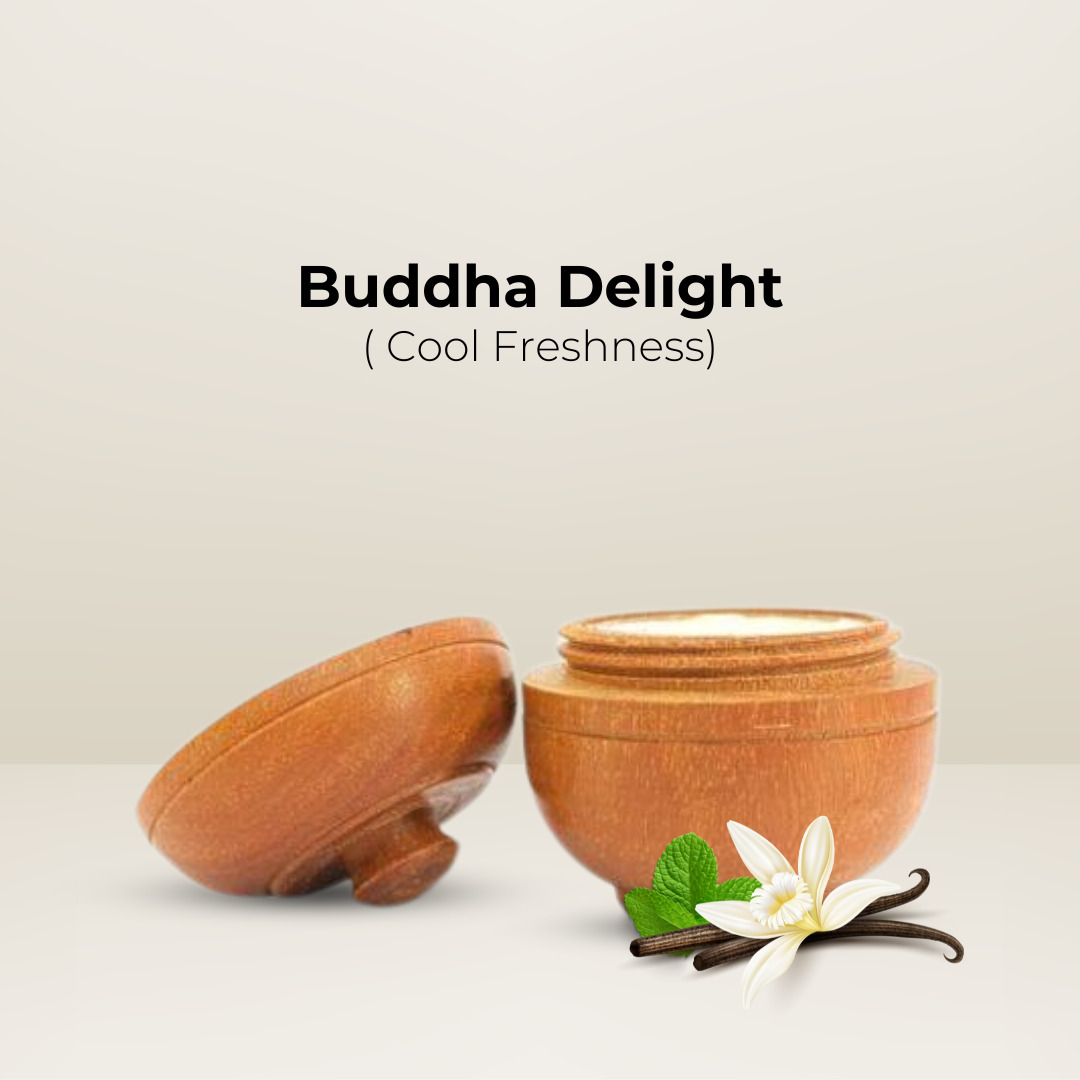 Open wooden jar of Natural Solid Body Wax Perfume "Buddha Delight" with vanilla bean and flower beside it.