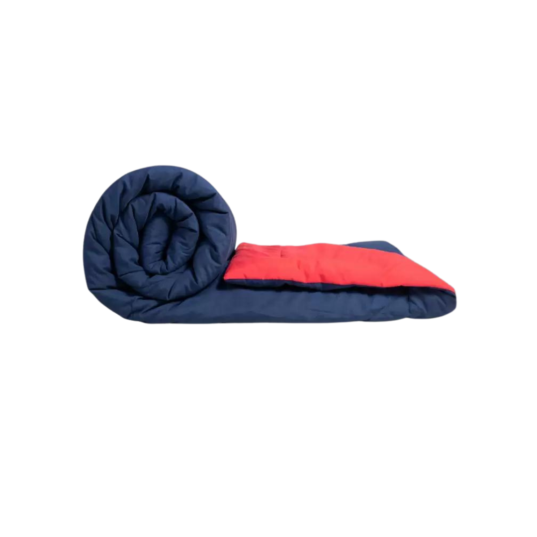 A navy blue and red Bellolin Microfibre Reversible Comforter, rolled up to show its soft and comfortable texture. This lightweight, breathable comforter is perfect for a double bed.