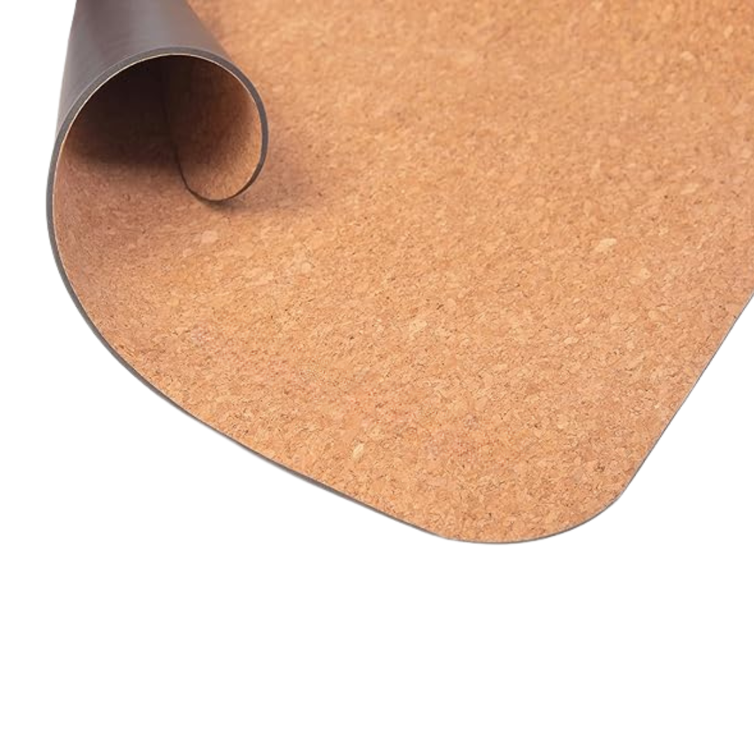 Rolled-up cork yoga mat on a white background.