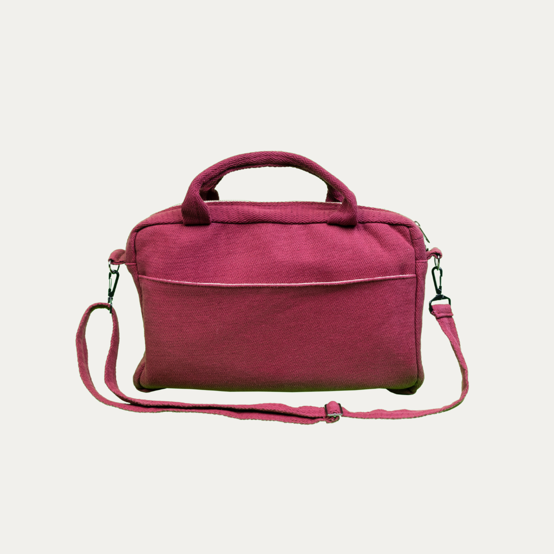 Handmade, natural hemp and cotton blend side bag in a rich burgundy. Features a front pocket and adjustable strap.