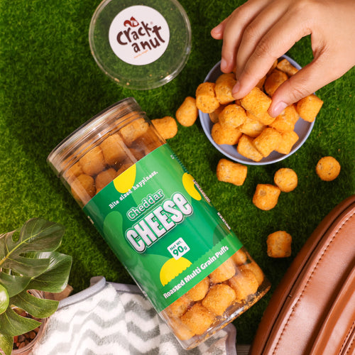 Crack A Nut's Cheddar Cheese Roasted Multi-Grain Puffs, Savory & Healthy Snack, Packed with Protein & Low in Sugar, Lightly Roasted Multi-Grain Goodness, Perfect for Cravings & Guilt-Free Indulgence, 100g.