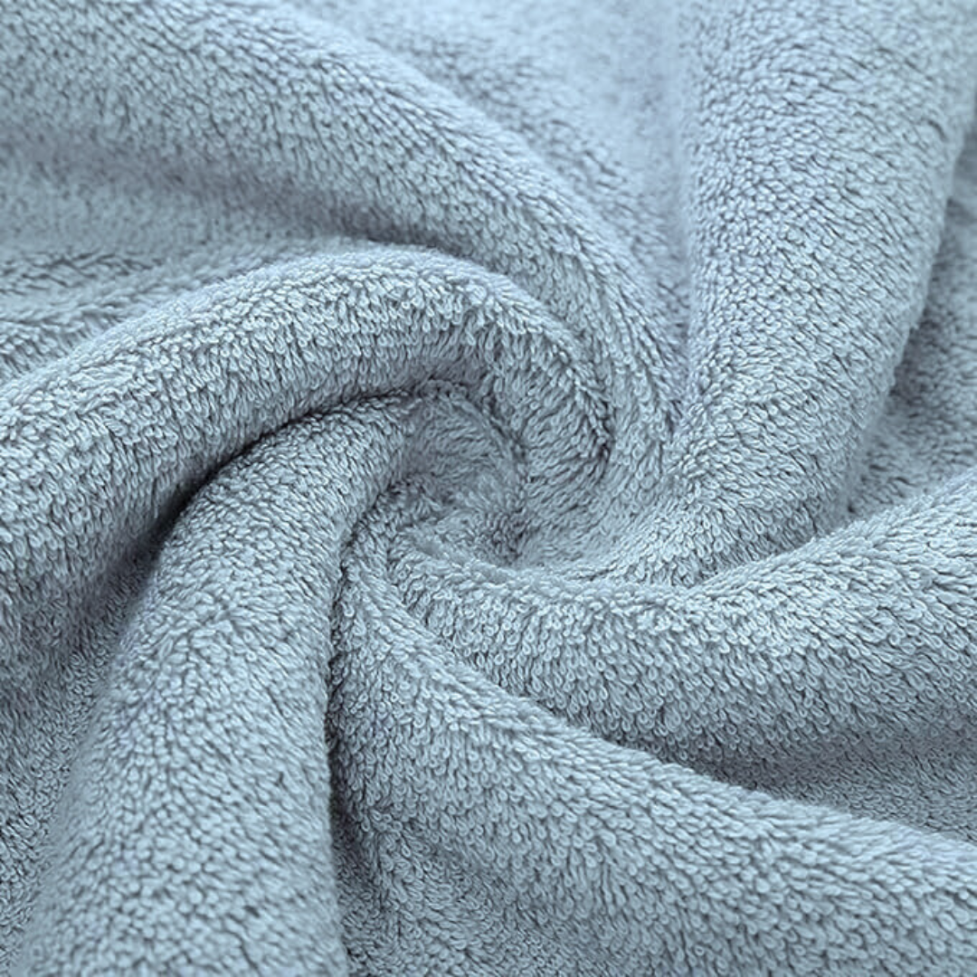 Soft, plush, light blue bamboo cotton bath towel. Luxurious and absorbent for a spa-like experience.