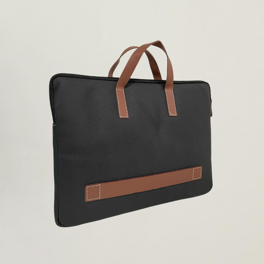 Black laptop bag with faux leather handles and accent, shown from the side. Fits laptops up to 15.6".