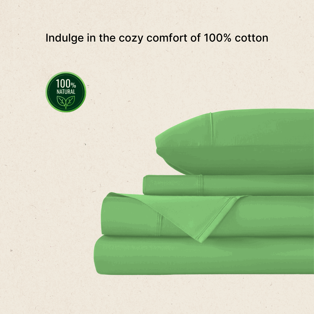 Cozy green 100% Egyptian cotton bed sheets neatly stacked with a pillow on top. 300 thread count, queen size.