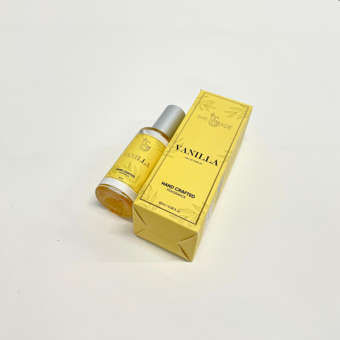 Sweet Vanilla Perfume Unisex in a 60ml bottle and yellow packaging. This hand-crafted fragrance boasts a sweet vanilla scent.