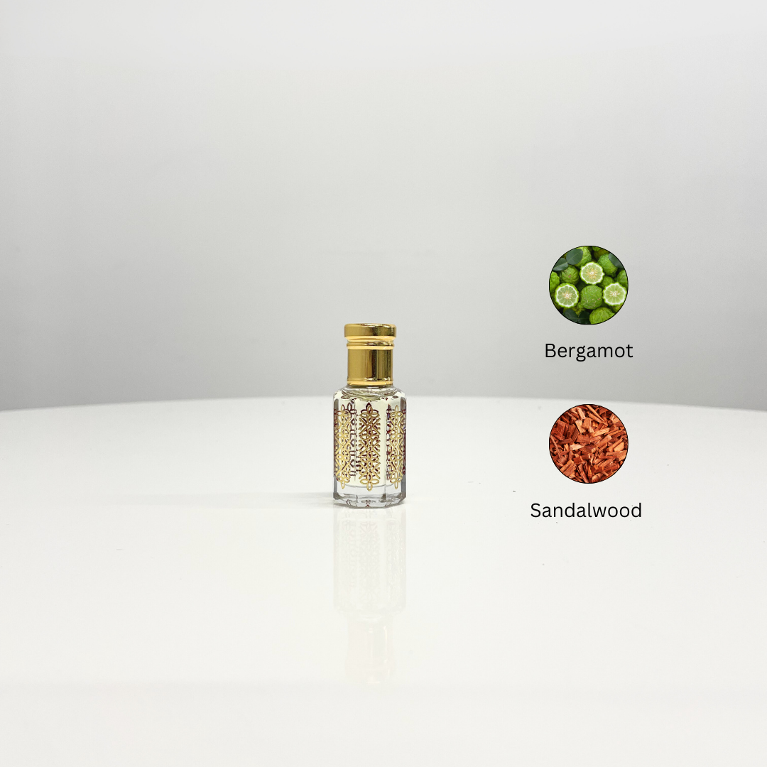 Morning Blossom Attar Unisex perfume in an ornate glass bottle. Fragrances include bergamot and sandalwood.