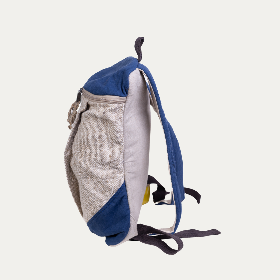 Side view of a blue and beige handcrafted hemp backpack with a pure cotton lining, showcasing its durable and eco-friendly design.