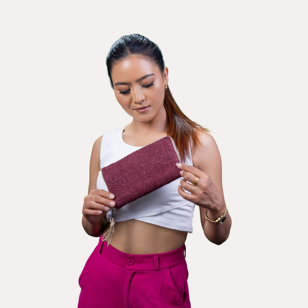 Stylish woman holding a maroon Compact Light Weighted Maya Hemp Clutch Wallet.