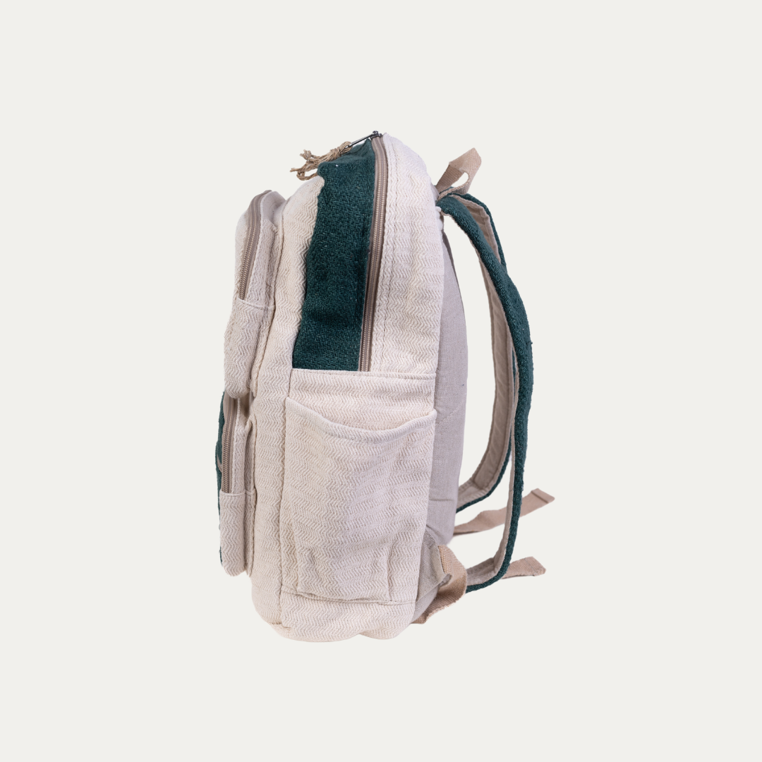 Handmade hemp backpack with multiple pockets, shown in a side view to highlight the spacious design and durable, natural fabric.