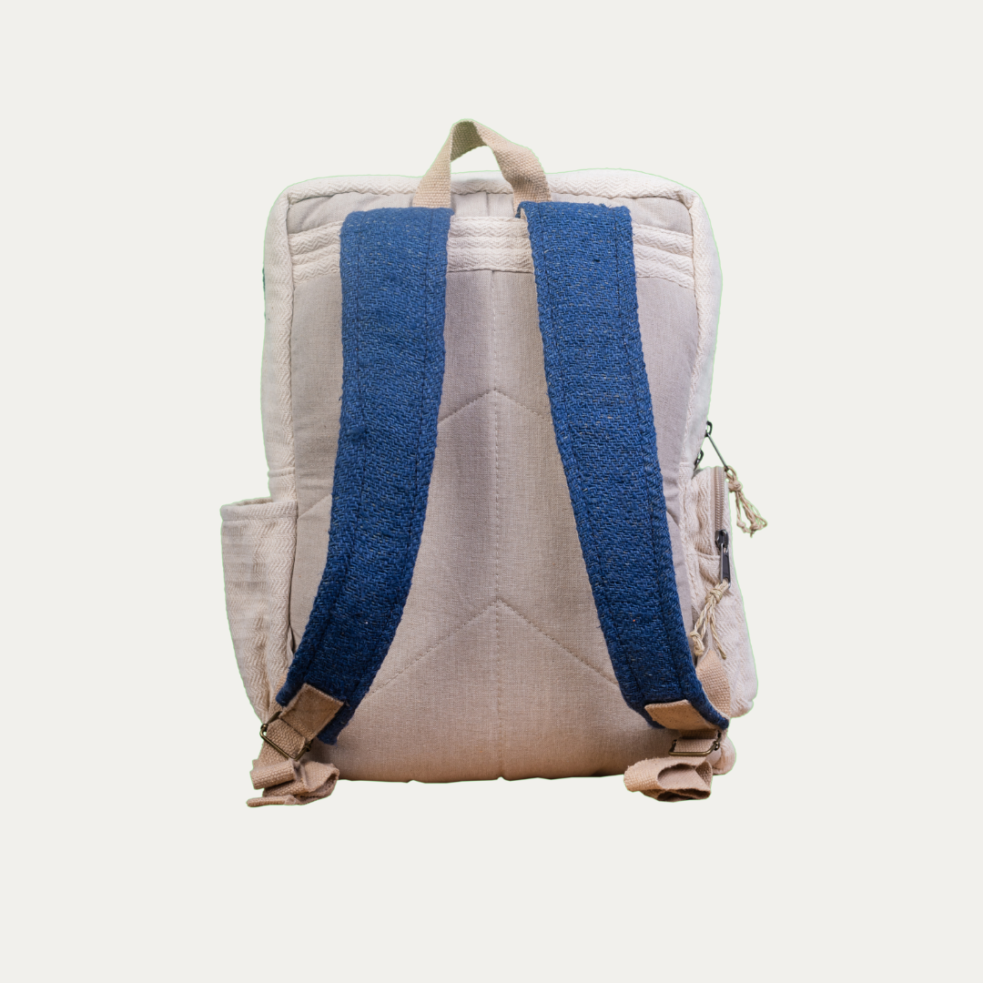 Handmade hemp backpack with multiple pockets, shown from the back with adjustable blue shoulder straps.