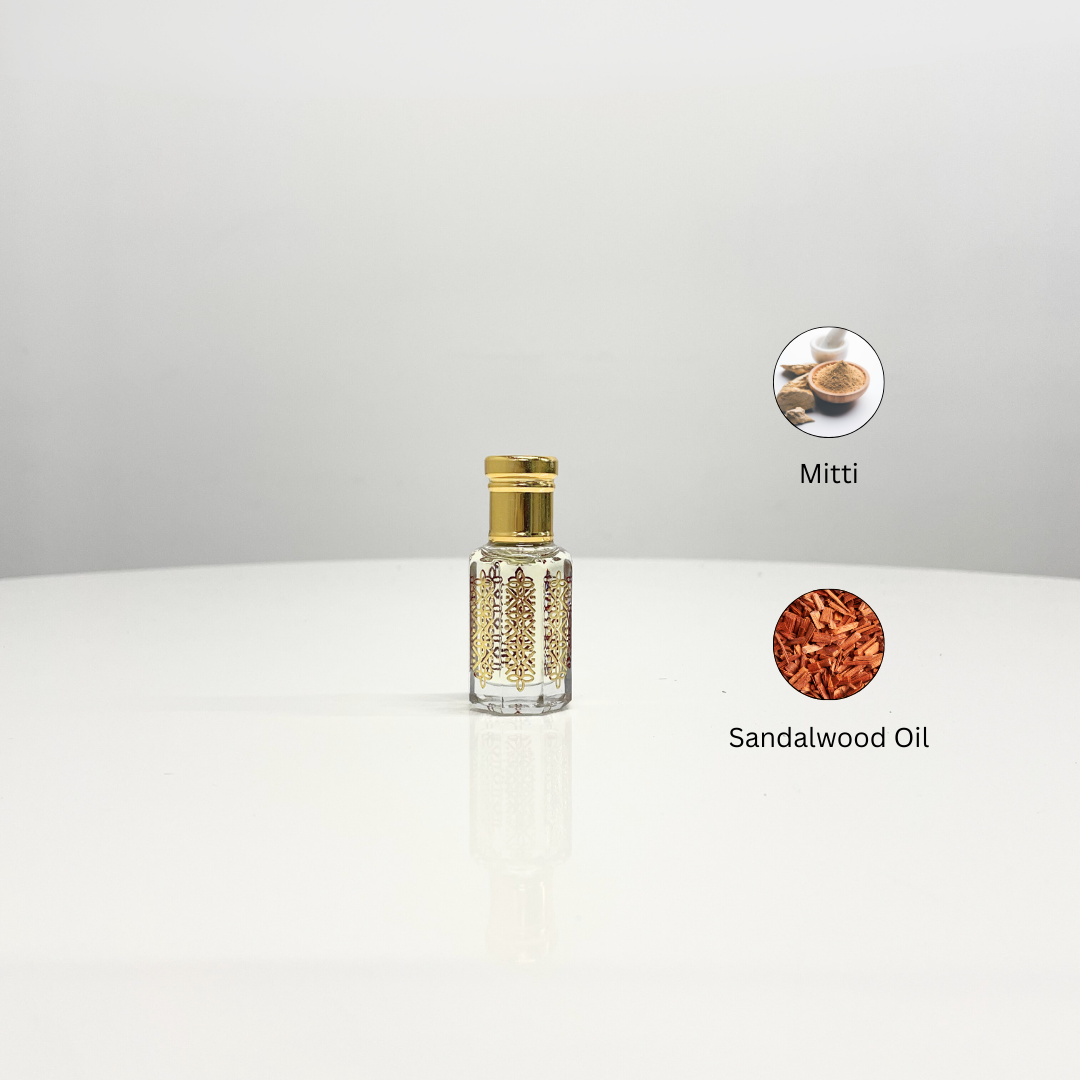 Mitti Attar Unisex perfume in an ornate glass bottle, showcasing the fragrance's earthy mitti and warm sandalwood notes.