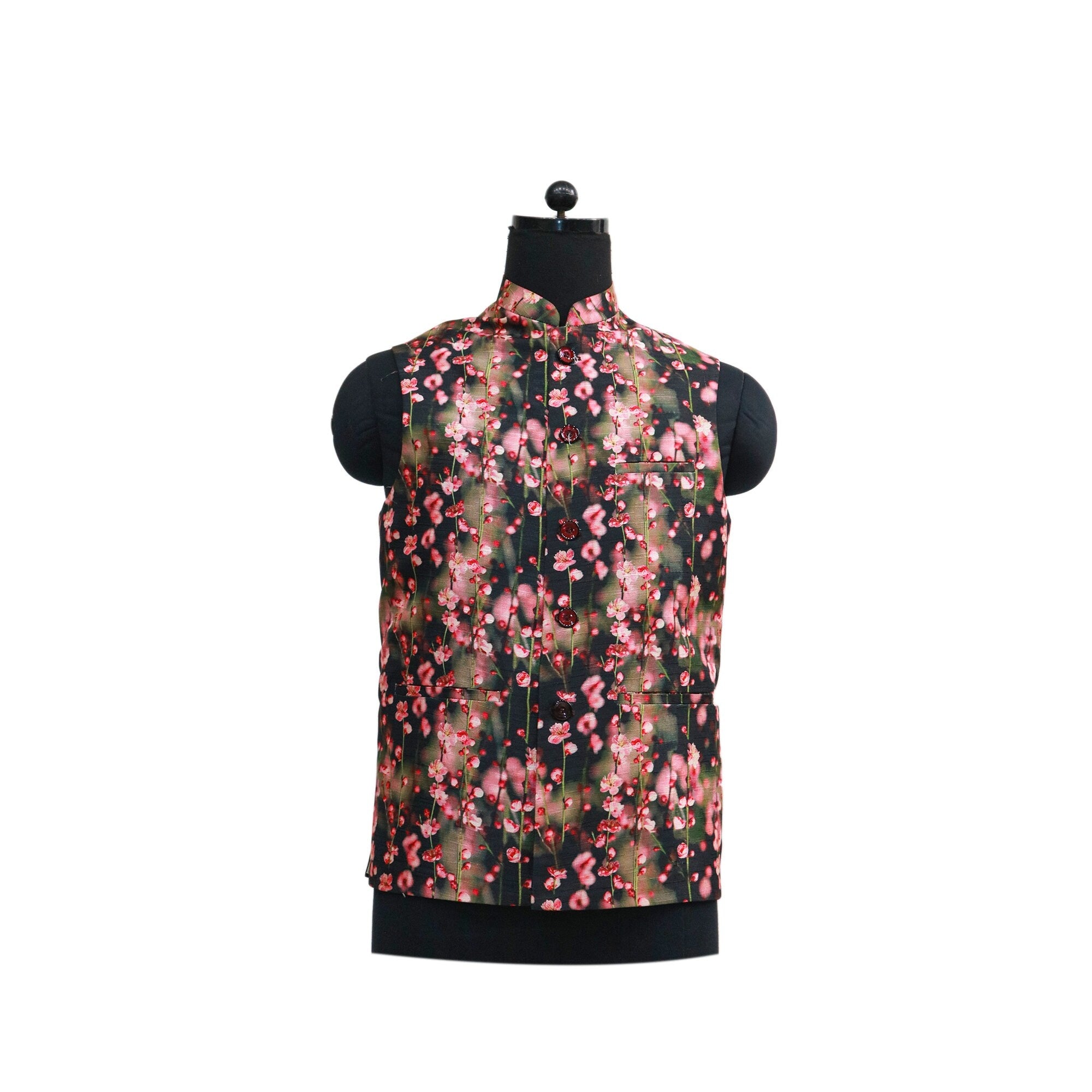 A black men's Nehru jacket with a vibrant pink floral print displayed on a mannequin.